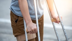 Military personnel using crutches