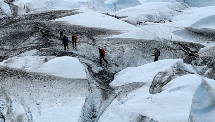 Recovery team members traverse Colony Glacier, Alaska, June 2019. The recovery team was searching for remains from a C-124 Globemaster II that crashed into Gannett Mountain, Alaska, on Nov. 22, 1952, while flying from McChord Air Force Base, Washington, to Elmendorf Air Force Base, Alaska resulting in the loss of 52 service members. (Courtesy photo)