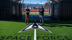 GRT member Kyle Warf (right), Physical Therapist poses for a photo with Alex Morrow (left), Holistic Health Integrator at the GRT training facility