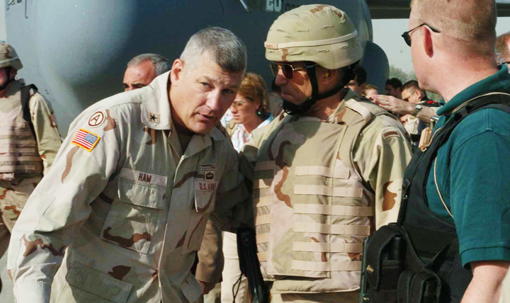 Then-Brig. Gen. Carter Ham (left) talks with the Army vice chief of staff, Gen. George Casey, after senior military leaders arrive in Mosul, Iraq, in June 2004.  (Courtesy photo) 