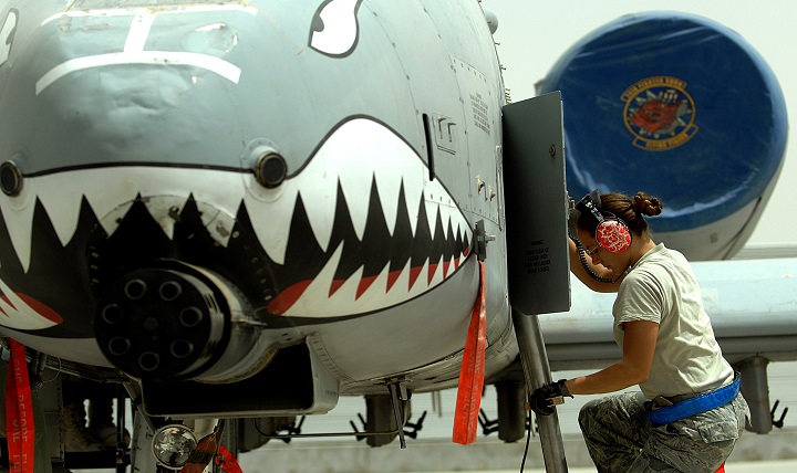 Link to Photo: U.S. Air Force Senior Airman Judith Bulkley, an electrical and environmental systems specialist deployed from the 23rd Aircraft Maintenance Squadron, Moody Air Force Base, Ga., exits an A-10C Thunderbolt II after performing an external power operations check on the aircraft at Kandahar Airfield, Afghanistan. Because service members in particular are often exposed to high noise levels, hearing protection is crucial, especially with a TBI. (U.S. Air Force photo by Tech. Sgt. Stephen Schester)