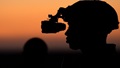 Military personnel preparing for night vision training