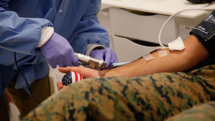Image of Military personnel donating blood. Click to open a larger version of the image.