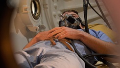 After suffering a harrowing injury which threatened both his life and limb, U.S. Navy Lt. Lyman Woollens, a family medicine physician assigned to Naval Hospital Bremerton’s urgent care clinic, has started to receive extensive rehabilitation treatment under the guidance of U.S. Navy divers and Navy Medicine undersea medicine using the oldest certified dive chamber on Naval Undersea Warfare Center. The chamber for hyperbaric oxygen therapy, affectionally known as “The Whale,” improved his recuperation process. (Photo by Douglas H Stutz, NHB/NMRTC Bremerton public affairs officer). 