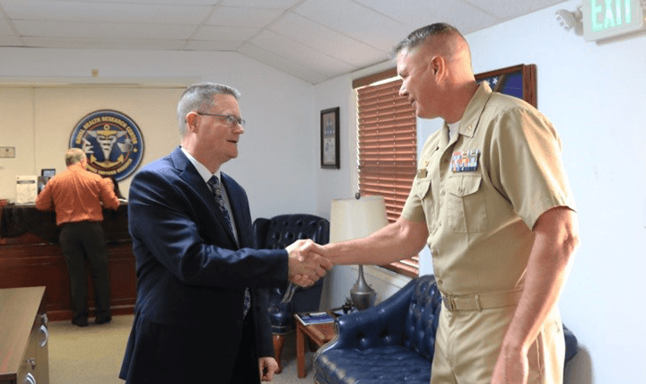 SAN DIEGO (Oct. 25, 2017) The Defense Health Agency’s (DHA) acting director for Research and Development, Sean Biggerstaff, left, is greeted by Naval Health Research Center (NHRC) commanding officer, Capt. Marshall Monteville, right, during a recent visit to the command. Biggerstaff is responsible for prioritizing and integrating DHA medical research, development, and acquisition programs across the Military Health System. His directorate also fosters strategic partnerships and transitions medical discoveries to deployable products to enhance the readiness of the military community. During the visit, Biggerstaff learned how NHRC’s mission aligns with DHA’s priorities to improve the health and readiness of U.S. warfighters. (U.S. Navy photo by Regena Kowitz/Released)