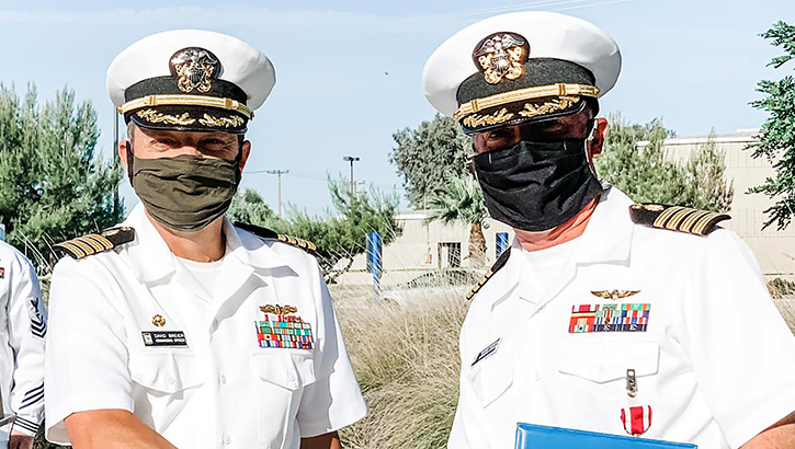 Image of Two medical officers wearing masks. Click to open a larger version of the image.