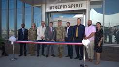 From left to right, Dr. Nicholas Asobo with William Beaumont Army Medical Center Traumatic Brain Injury Department, Lt. Col. Shannon Ford, Mr. Jason Rainey, Mr. David Winters, Col. Lee Freeman, commander of WBAMC, SSGT Spencer Milo, Dr. Sean Sebesta, director of TBI Department, WBAMC, Mr. Christopher Scott, patient advocate, WBAMC, and Ms. Lisa Yaconiello partake in the ribbon-cutting ceremony for the newly opened Intrepid Spirit Center at Fort Bliss, on September 18, 2024 on the campus of WBAMC hospital. (Photo by Staff Sgt. Lauren Feick)