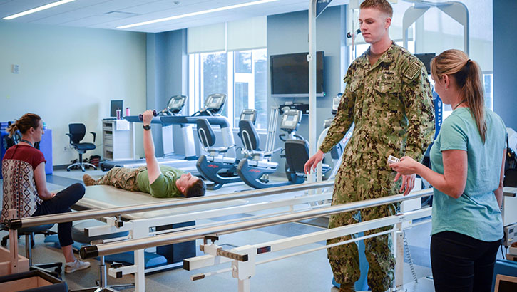 Military health personnel in physical therapy