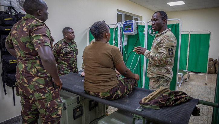 U.S. Army Spc. Israel Osagie, 425th Medical Detachment, 176th Medical Brigade, 807th Medical Command, practical nursing specialist, demonstrates the electrocardiogram machine with the doctors and nurses of the Kenyan Defence Forces in Nanyuki, Kenya on Feb, 29, 2024. (Photo by U.S. Army Reserve Spc. Ronald Bell)