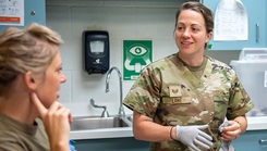 Tech. Sgt. Cristen E. Lane, an aerospace medicine technician for the 123rd Medical Group, speaks with a patient at the Kentucky Air National Guard Base