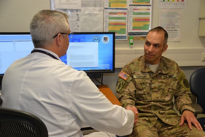 Dr. Michael Kennedy (left), a family medicine provider at Landstuhl Regional Medical Center, discusses the importance of proactive health readiness with Army Maj. Oscar Ochoa. With a focus of preventive prostate screening, healthy eating and physical fitness, Kennedy emphasized the importance of men to stay engaged in their health care and not to wait until the last minute to be seen by a primary care provider. (U.S. Army photo by Stacy Sanning)