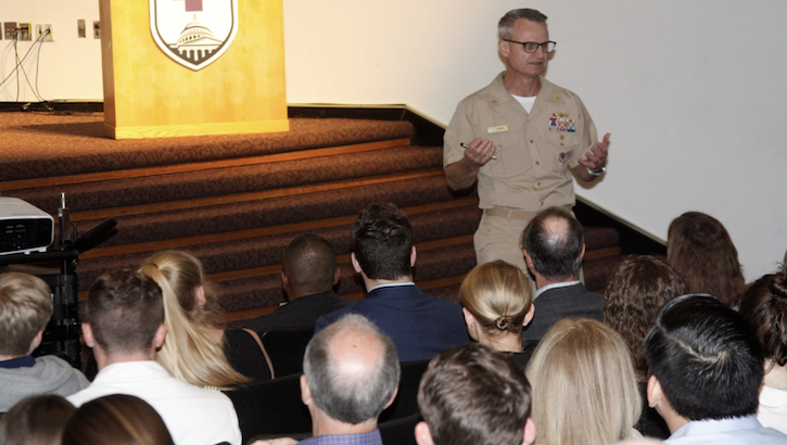 Navy Capt. Felix Drew Bigby addresses students at WRNMMC