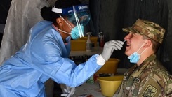 Army soldier gets nose swab