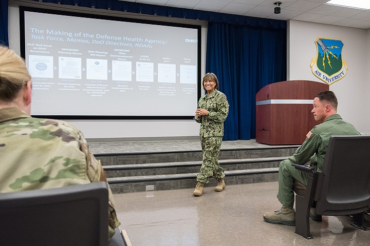 Navy Vice Adm. Raquel Bono, Defense Health Agency director, speaks with members of the 42nd Medical Group about upcoming changes to military treatment facilities, at Maxwell Air Force Base, Alabama. The DHA will be responsible for all facilities with respect to budgetary matters, information technology, health care administration and management, administrative policy and procedure and military medical construction. (U.S. Air Force photo by William Birchfield)
