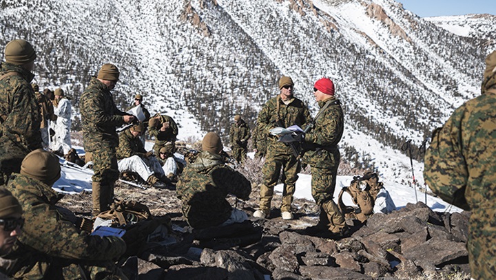 Image of Service members on a mountain.