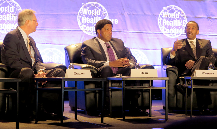 Dr. Jonathan Woodson, assistant secretary of defense for Health Affairs, (far right) answers questions by panel moderator Merrill Goozner, editor of Modern Healthcare magazine (far left) at World Health Congress in downtown Washington, DC.