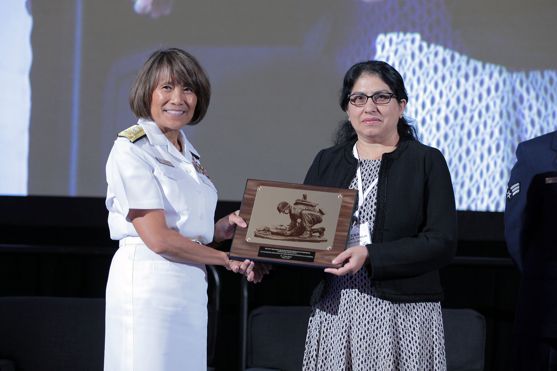 Vice Admiral Raquel C. Bono, director of the Defense Health Agency, presented Veena Taneja, Ph.D. with the 2017 Individual Research Accomplishment for academia, in the category of Precision Medicine, today at the Military Health System (MHS) Research Symposium. The Individual Research Accomplishment award recognizes outstanding contributions by an individual scientist that had a high impact on MHS research within the past year.  Taneja is an Associate Professor in the Department of Immunology at the Mayo Clinic, and her research centers on understanding the role of the immune system in the development of rheumatoid arthritis. She is recognized today for her research that discovered a new biomarker that can be used to treat inflammatory arthritis. 