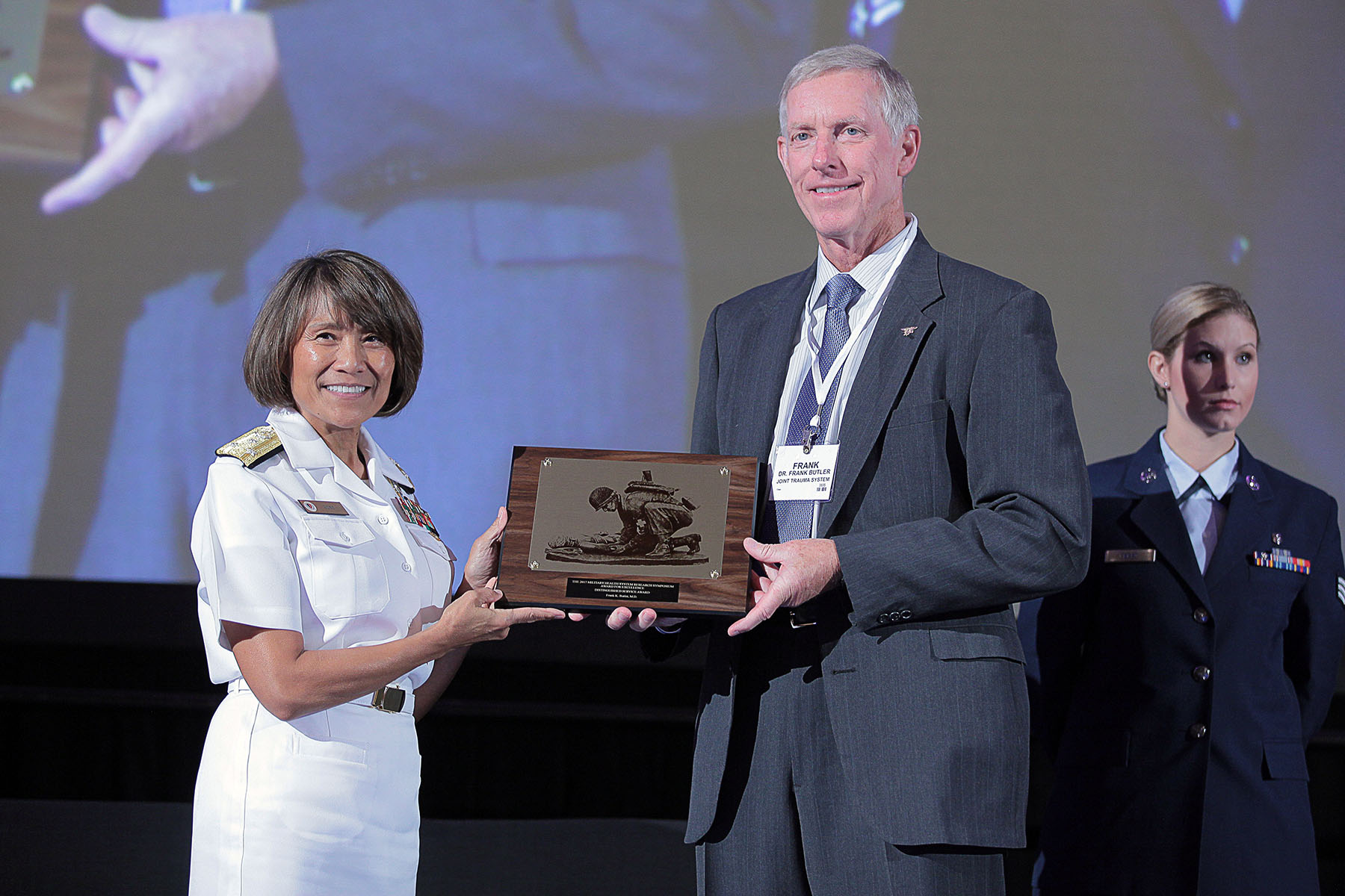 Vice Admiral Raquel C. Bono, director of the Defense Health Agency, presented Frank K. Butler, Jr., M.D. with the 2017 Distinguished Service Award, in the category of Combat Casualty Care, today at the Military Health System (MHS) Research Symposium. The Distinguished Service Award is a lifetime achievement award recognizing an individual who contributed significantly to the success of MHS research and who demonstrates outstanding leadership.