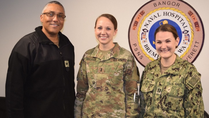 Navy Capt. Johannes Bailey, Naval Hospital Bremerton Director for Nursing Services (left) and Navy Lt. Kaitlyn Harmon, NHB Multi Service Unit (right), flank Army 1st Lt. Lauren Odegaard, from Madigan Army Medical Center, for a photo op after thanking her for her assistance. Odegaard provided assistance for the month of October in NHB's MSU to help with staffing shortages. (U.S. Navy photo by Douglas H. Stutz)