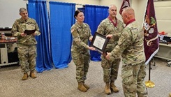 U.S. Army National Guard Col. Frederick Looper, commander of the medical readiness unit, Maine Army National Guard; U.S. Army National Guard 1st Sgt. Jayme Saucier, first sergeant of the MRU; U.S. Army National Guard Lt. Col. Joel Dunn, deputy state surgeon, MEARNG; U.S. Army National Guard Col. George Horsley, state surgeon general, Massachusetts Army National Guard receiving an award