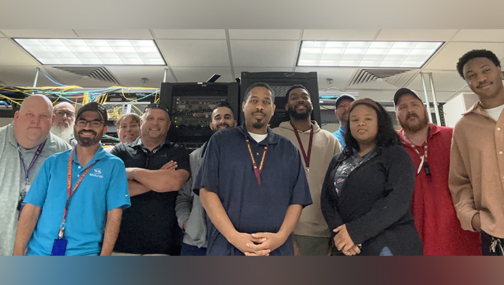 The Defense Health Agency team and Kenner's Information Management Department stand together after successfully completing the clinic-wide network upgrade.