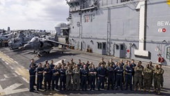U.S. Sailors assigned to Fleet Surgical Team 4 and Marines assigned to the 24th Marine Expeditionary Unit Special Operations Capable, embarked aboard the amphibious assault ship USS Wasp pose for a group photograph on the flight deck, July 5, 2024. Wasp is on a scheduled deployment to the U.S. Naval Forces Europe and Africa area of operations as the flagship of the Wasp Amphibious Ready Group, in support of U.S., Allied and partner interests in the region, including in the Eastern Mediterranean Sea, to continue promoting regional stability and deterring aggression. (Photo by U.S. Navy Chief Mass Communication Specialist Ruben Reed)