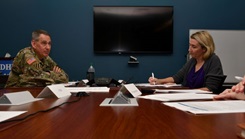 Military personnel during a virtual round table discussion