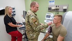 Brenda Couch watches over U.S. Air Force Tech. Sgt. Ron Sparkman, a student at the 155th medical group with the Nebraska National Guard, as he checks vitals on an airman during training at Wright-Patterson Medical Center on June 13. Operational Medical Readiness Squadron was this month’s pick for “Dominate the Dirty Work,” a series of stories offering an in depth look at the hard working and dedicated individuals that often go unseen. (Photo: Kenneth J. Stiles, U.S. Air Force) 