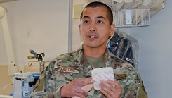 Air Force 1st Lt. Rassel Kibigting, registered nurse on 2W, demonstrates proper tracheostomy care during the simulation skills fair