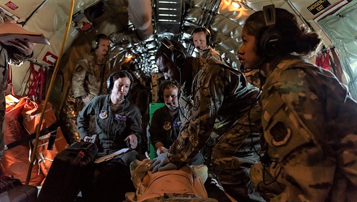 Airmen from the 18th Aeromedical Evacuation Squadron simulate life-saving procedures to a training manikin onboard a KC-135 Stratotanker during an exercise out of Kadena Air Base, Japan. The 18th AES maintains a forward operating presence, and was instrumental in saving an Airman’s life. (U.S. Air Force photo by Senior Airman Matthew Seefeldt)