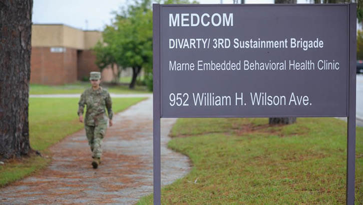 Military personnel in front of the Marne Embedded Behavioral Health Clinic on Fort Stewart
