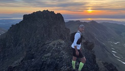 U.S. Coast Guard Lt. Cmdr. Duane Zitta on top of a mountain