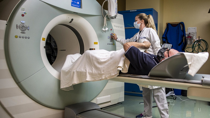 Image of a patient prepares for a PET scan. Click to open a larger version of the image.
