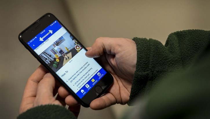 Image of A smartphone user using the DHA's Air Force MissionFit app. Click to open a larger version of the image.