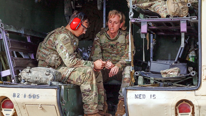 Image of Military personnel during a hearing test.