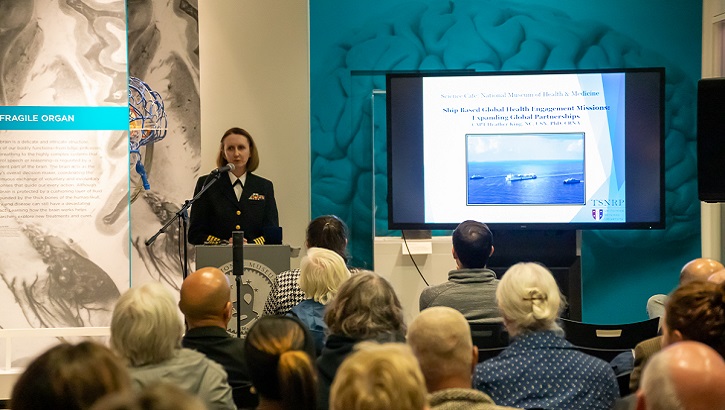 Navy Capt. Heather King, executive director of the TriService Nursing Research Program at the Uniformed Services University, details the process of ship-based global health engagement missions during the October 22, 2019, Medical Museum Science Café titled "Ship-Based Global Health Engagement Missions: Expanding Global Partnerships" at the National Museum of Health and Medicine in Silver Spring, Maryland. (NMHM photo)