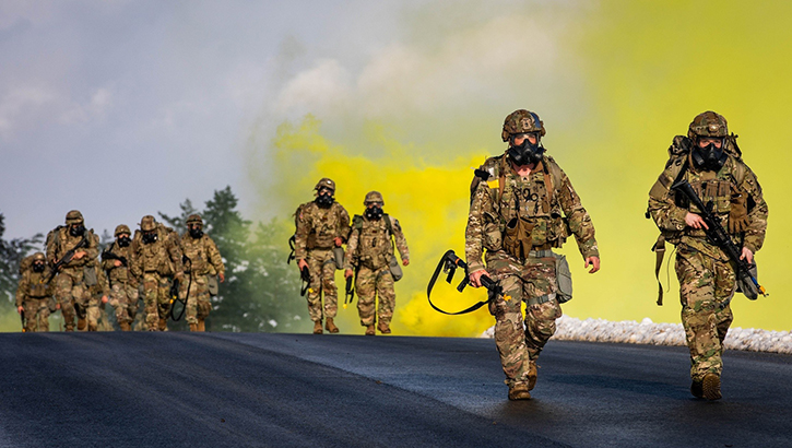 U.S. Soldiers run for a chemical, biological, radiological, nuclear exercise during European Best Medic Competition at Grafenwoehr, Germany, on Dec. 7, 2023.  (Photo by U.S. Army Spc. William Kuang)