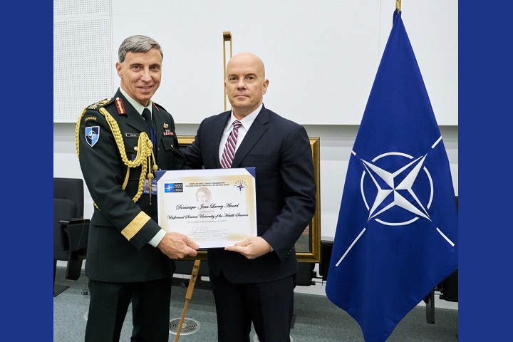 Major-General Jean-Robert Bernier (left), chair of NATO's Committee of Chiefs of NATO Medical Services, presents the 2018 Dominique-Jean Larrey Award to Dr. Richard Thomas, president of the Uniformed Services University of the Health Sciences. The Larrey Award is NATO's highest honor for medical support. (Photo courtesy of NATO)
