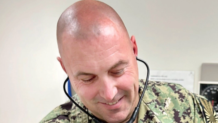 Lt. j.g. Sean Hufford, a physician assistant at Naval Branch Health Clinic Albany, listens to a patient’s heart.