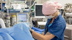 U.S. Navy Lt. Melissa Belle, certified registered nurse anesthetist, monitors and resuscitates an active duty service member during an orthopedic surgical procedure  to restore the service member to a deployable status at naval Medical Center San Diego, Jan. 23.