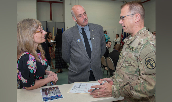 Army Maj. Gen. Brian C. Lein, Commanding General, U.S. Army Medical Research and Materiel Command and Fort Detrick (right), speaks with Beth Eubanks, registrar, National Museum of Health and Medicine and Alan Hawk, NMHM historical collections manager, following a ceremony held on Friday, Aug. 28, 2015 to acknowledge the transition of NMHM from USAMRMC to the Defense Health Agency. (Photo by Matthew Breitbart, National Museum of Health and Medicine)