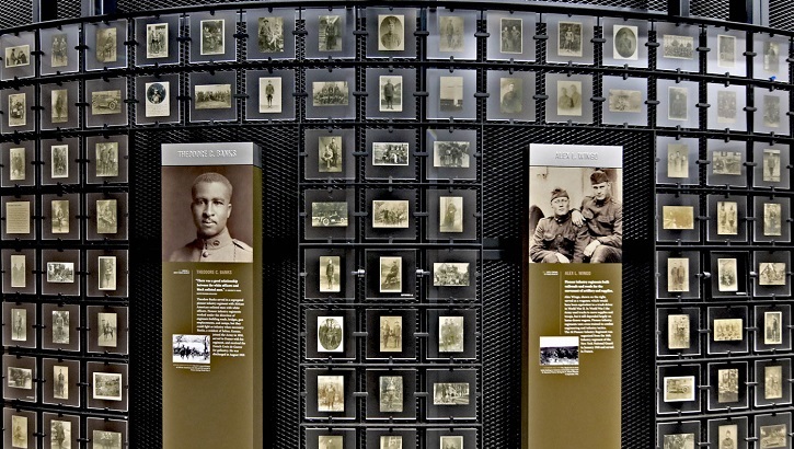 Wall in the museum with pictures and interactive displays