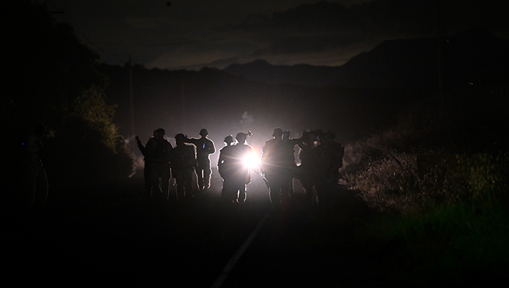 military personnel on nighttime training patrol