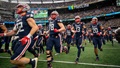 Naval Academy football team runs onto the field 