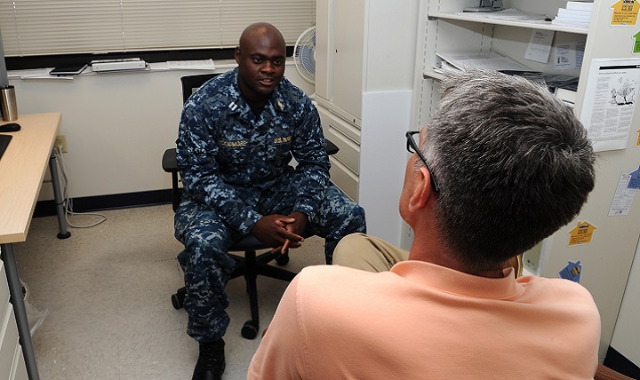 Navy Lt. Terrance Skidmore, a social worker, speaks to a patient during a one-on-one session. The month of May is designated Mental Health Awareness Month with the purpose of raising awareness about mental illnesses. (U.S. Navy photo by Ensign Courtney Avon)