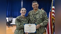 Hospitalman Apprentice Skylar L. Foote, left, assigned to U.S. Naval Hospital Yokosuka, receives the Navy and Marine Corps Achievement Medal from Capt. Donavon YapShing, executive officer of U.S. Navy Medicine Readiness and Training Command Yokosuka and deputy director of U.S. Naval Hospital Yokosuka, during an awards ceremony.