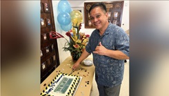 Military personnel celebrates with cake