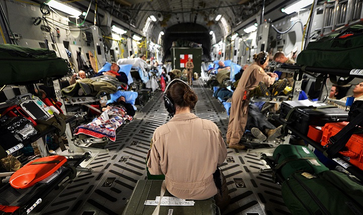Members of the of the 455th Expeditionary Aeromedical Evacuation Squadron assist patients on medical transport flight out of Bagram Airfield, Afghanistan. Air Force nurse scientists are conducting valuable research to improve en route patient care during aeromedical evacuations. (U.S. Air Force photo by Christopher Willis)