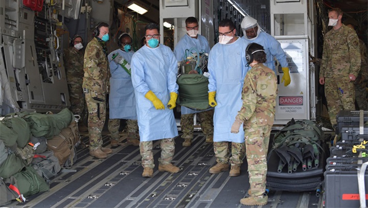 Image of 12 COVID-19 patients aboard a C-17 Globemaster III aircraft.