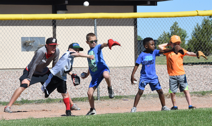 Children participate in a sports clinic at Schriever Air Force Base, Colorado. The installation partnered with the YMCA of Pikes Peak Region to teach young athletes the fundamentals of baseball, gymnastics, soccer, and basketball. (U.S. Air Force photo by Staff. Sgt. Wes Wright) 